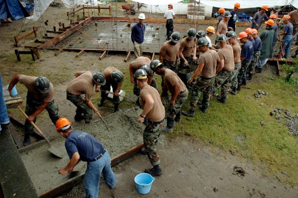 060726-N-0553R-002 San Fernando, Philippines (July 26, 2006) - Philippine Navy Seabees and U.S. Navy Seabees assigned to Naval Mobile Construction Battalion One (NMCB-1) form a Òbucket brigadeÓ to transfer concrete from the truck to the pad during a concrete placement in San Fernando. NMCB-1 deployed 23 Seabees to the Philippines to participate in CARAT 2006, and to work and train with the Philippine Seabees. The Seabees while deployed to the Philippines will construct two classrooms for the Mabanengbeng Elementary School. U.S. Navy photo by Mass Communication Specialist 3rd Class Ja'lon A. Rhinehart (RELEASED)